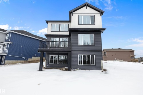 Snow covered house with a balcony - 718 Elderberry Close Nw, Edmonton, AB - Outdoor