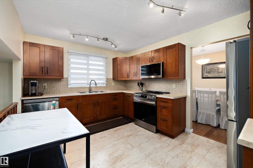 9804 156 Avenue, Edmonton, AB - Indoor Photo Showing Kitchen With Stainless Steel Kitchen With Double Sink