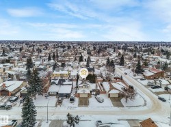 Snowy aerial view featuring a residential view - 