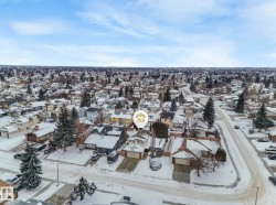 Snowy aerial view featuring a residential view - 
