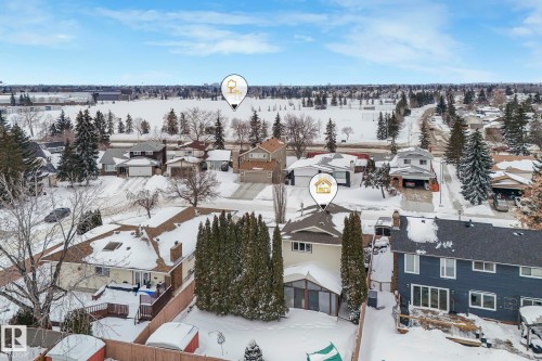 Snowy aerial view featuring a residential view - 15909 112 B Street Nw, Edmonton, AB - Outdoor With View