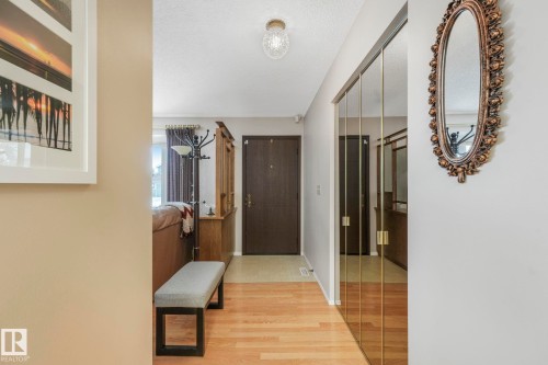 Corridor featuring light wood-style floors and a textured ceiling - 15909 112 B Street Nw, Edmonton, AB - Indoor Photo Showing Other Room