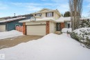 View of front of property with brick siding and a garage - 15909 112 B Street Nw, Edmonton, AB  - Outdoor With Facade 