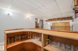 Staircase featuring a drop ceiling - 