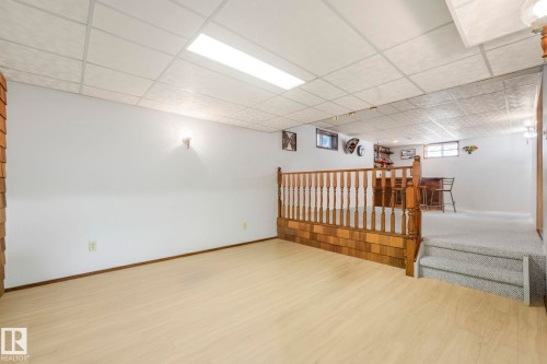 Spare room with a drop ceiling and wood finished floors - 15909 112 B Street Nw, Edmonton, AB - Indoor Photo Showing Other Room