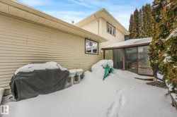 Snow covered property with a sunroom - 