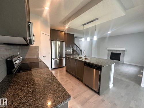 Mainfloor 9455 227 Street, Edmonton, AB - Indoor Photo Showing Kitchen With Stainless Steel Kitchen With Double Sink With Upgraded Kitchen