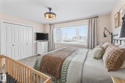 Bedroom with light carpet and a closet - 