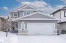 View of front of property featuring stone siding and an attached garage - 10415 94 Street, Morinville, AB  - Outdoor 