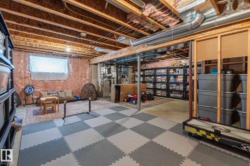 Basement featuring heating unit - 10415 94 Street, Morinville, AB - Indoor Photo Showing Basement
