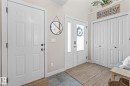 Foyer featuring baseboards and stone finish floors - 10415 94 Street, Morinville, AB  - Indoor Photo Showing Other Room 