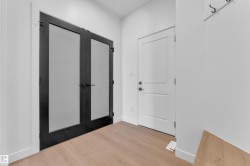 Foyer featuring french doors and wood finished floors - 