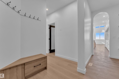 Mudroom with recessed lighting, arched walkways, and light wood finished floors - 95 Eldridge Point(E), St. Albert, AB - Indoor Photo Showing Other Room