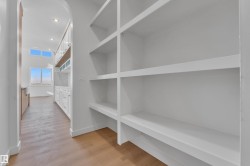 featuring light wood-style floors and arched walkways - 