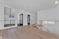 Spare room featuring wood finished floors and recessed lighting - 