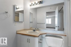 Bathroom featuring vanity and a baseboard heating unit - 