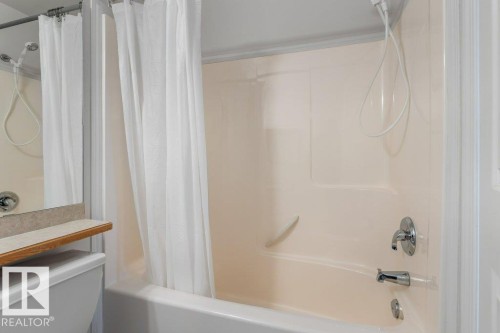 Full bathroom with shower / bath combo and toilet - 403 14708 50 Street, Edmonton, AB - Indoor Photo Showing Bathroom