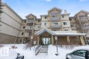 Snow covered building featuring a view of apartment building / complex - 403 14708 50 Street, Edmonton, AB  - Outdoor With Balcony With Facade 