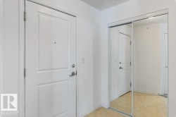 Foyer featuring a textured ceiling and light flooring - 