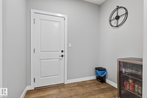 Doorway to outside featuring wood finished floors and baseboards - 1027 150 Avenue, Edmonton, AB - Indoor Photo Showing Other Room