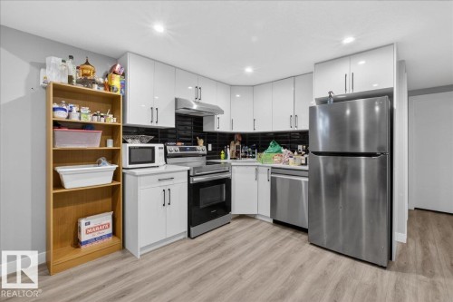 Living area featuring recessed lighting and wood finished floors - 1027 150 Avenue, Edmonton, AB - Indoor Photo Showing Kitchen