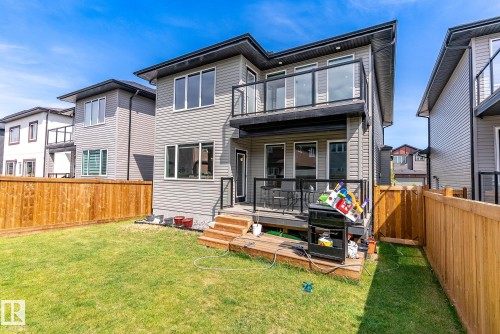 Back of property featuring a fenced backyard, a balcony, and a wooden deck - 1027 150 Avenue, Edmonton, AB - Outdoor With Balcony