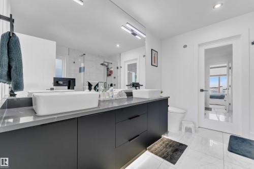 Bathroom featuring double vanity, a shower stall, ensuite bath, and recessed lighting - 316 42 Street, Edmonton, AB - Indoor Photo Showing Bathroom