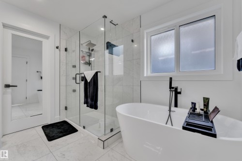 Full bath with a shower stall and a soaking tub - 316 42 Street, Edmonton, AB - Indoor Photo Showing Bathroom