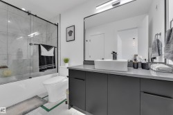Bathroom featuring vanity and combined bath / shower with glass door - 