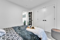 Carpeted bedroom featuring a closet - 