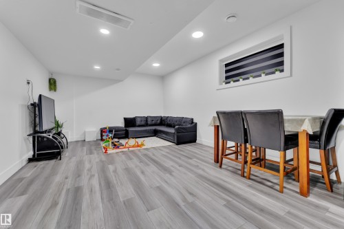 Living room featuring light wood-type flooring and recessed lighting - 316 42 Street, Edmonton, AB - Indoor