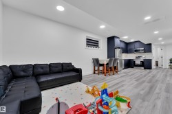 Living area with recessed lighting and light wood finished floors - 