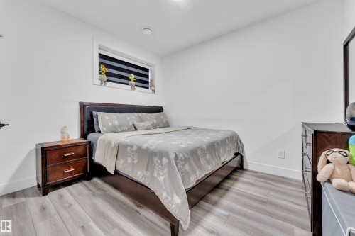 Bedroom with light wood finished floors - 316 42 Street, Edmonton, AB - Indoor Photo Showing Bedroom