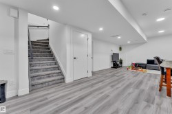 Finished basement featuring light wood finished floors and recessed lighting - 