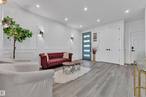 Living area featuring a decorative wall, wood finished floors, recessed lighting, and wainscoting - 316 42 Street, Edmonton, AB - Indoor