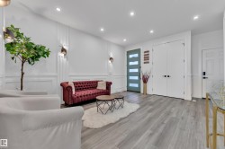 Living area featuring a decorative wall, wood finished floors, recessed lighting, and wainscoting - 