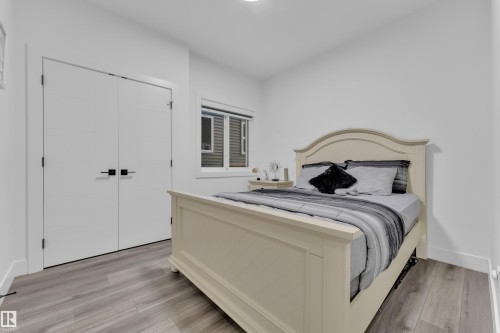 Bedroom featuring light wood-style floors and a closet - 316 42 Street, Edmonton, AB - Indoor Photo Showing Bedroom