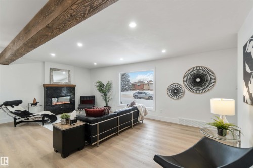 6719 95 Avenue, Edmonton, AB - Indoor Photo Showing Living Room With Fireplace