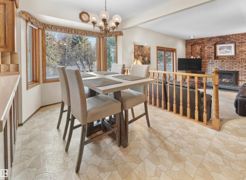 10908 Bearspaw Drive W, Edmonton, AB - Indoor Photo Showing Dining Room With Fireplace