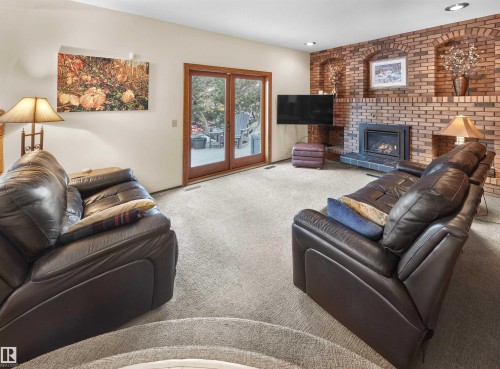 10908 Bearspaw Drive W, Edmonton, AB - Indoor Photo Showing Living Room With Fireplace