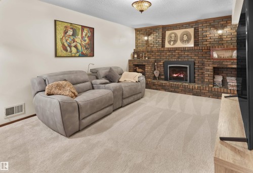 10908 Bearspaw Drive W, Edmonton, AB - Indoor Photo Showing Living Room With Fireplace