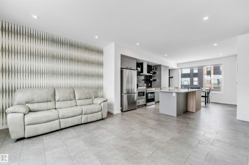 Living room with recessed lighting and an accent wall - 77 5 Rondeau Drive, St. Albert, AB - Indoor