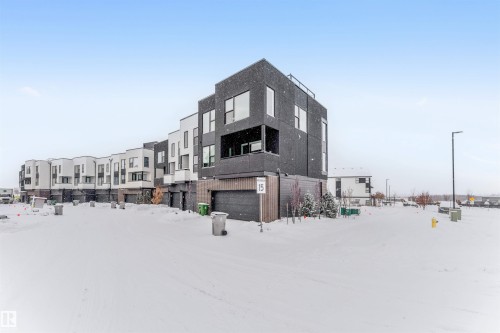 Snow covered building with a residential view - 77 5 Rondeau Drive, St. Albert, AB - Outdoor