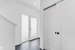 Entryway with recessed lighting and dark tile patterned flooring - 