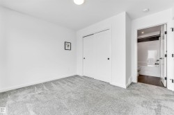 Unfurnished bedroom with carpet flooring and a closet - 