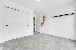 Unfurnished bedroom featuring light carpet and a closet - 