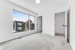 Unfurnished bedroom with baseboards and carpet - 