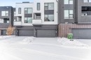 View of front of house with a garage - 77 5 Rondeau Drive, St. Albert, AB  - Outdoor With Facade 