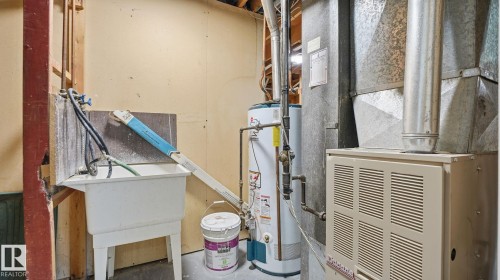 Utilities featuring heating unit and water heater - 3419 143 Avenue Nw, Edmonton, AB - Indoor Photo Showing Basement