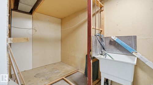 Miscellaneous room featuring unfinished concrete floors and a sink - 3419 143 Avenue Nw, Edmonton, AB - Indoor